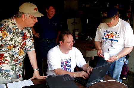 They all check out the VHF-UHF Station. Photograph by Norm Styer - AI2C de Clarkes Gap, VA.