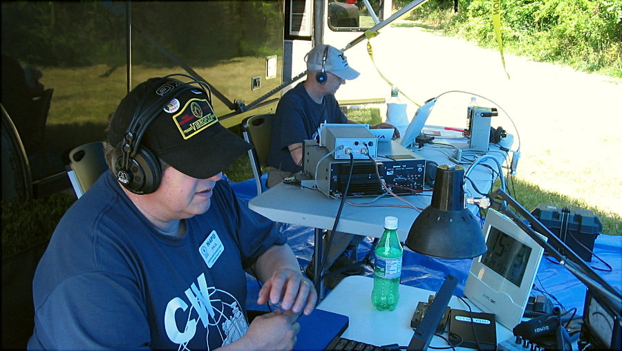 The prime CW stations. Paul Dluehosh - N4PD of Leesburg on 40-Meters CW and John Unger - W4AU of Hamilton on 20-Meters CW. Photograph by Meg Gentges- AI4UX of Great Falls, VA.