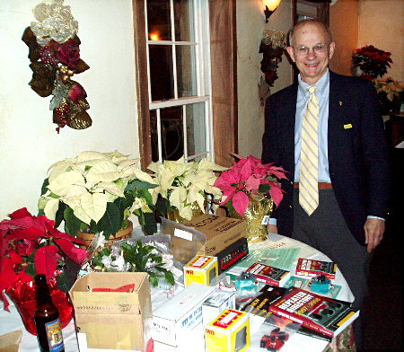 John Unger - W4AU shows off his collection of door prizes. Photograph by Norm Styer - AI2C of Clarkes Gap, Virginia.