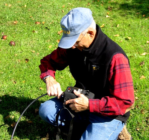 John Unger - W4AU checks the SWR on his 40M CW loop antenna. Photograph by Larry Hughes - K3HE of Leesburg, Virginia.