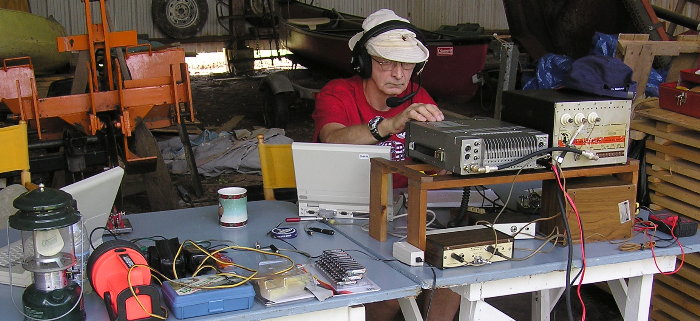 Norm Styer - AI2C working 15 Meters. Photograph by Denny Boehler - KF4TJI. Denny suspects that Norm may be seeking a QSO on Phone.