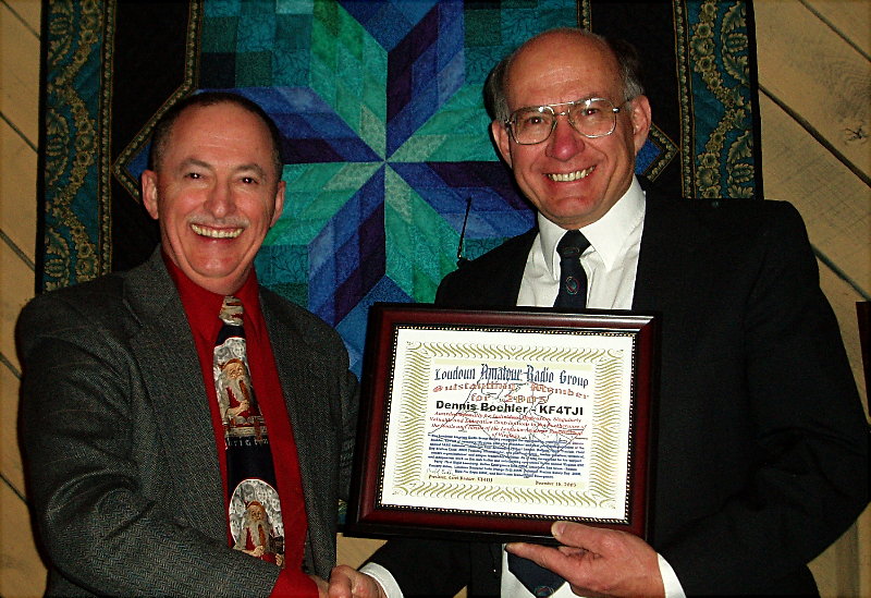 Dennis Boehler - KF4TJI of Leesburg is awarded the "Outstanding Member of 2005" by Gary Quinn -  NC4S. Photograph by Norm Styer - AI2C de Clarkes Gap, Virginia.