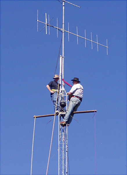 Gary - NC4S and David Mullins - K4ARP Up The Tower. Photograph by Tom Garasic - NA4MA of Haymarket, VA.