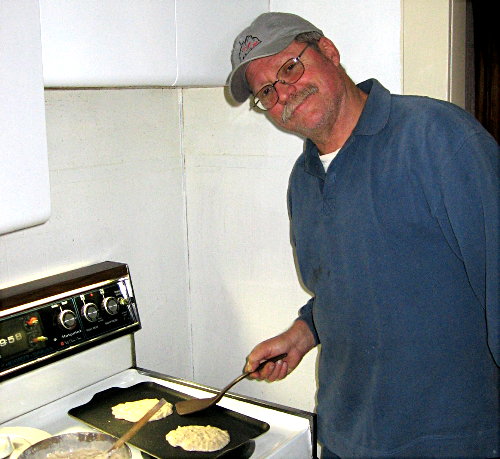 Tom Garasic - NA4MA worked up some of Angi Garasic's special pancakes for Saturdaty morning. Photograph by Larry Hughes - K3HE of Leesburg, Virginia.