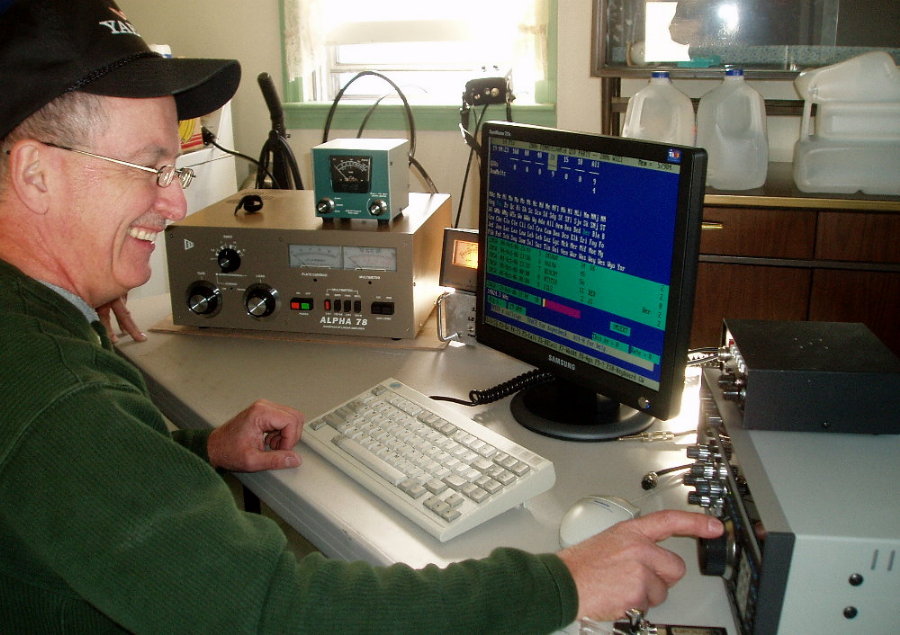 Gary Quinn - NC4S is all smiles as he tries out his super station on 20M. Photograph by Norm Styer - Ai2c of Clarkes Gap, Virgina.