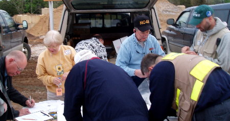 ARES members sign in to the operation, sign the 'no claim release statement and receive identification badges. Photograph by Norm Styer - AI2C de Clarkes Gap, Virginia.