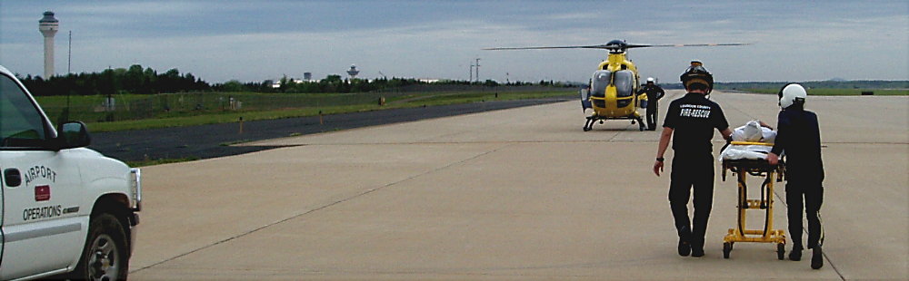 EMT's escort patient to waiting helo. Photograph by Norm Styer - AI2C de Clarkes Gap, VA.