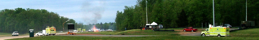 The Dulles International Airport Emergency Exercise 2007. The accident crash site as fire and rescue equipment rush to assist. On the right are the ARES three communications shelters and their antennas. Photograph by Norm Styer - AI2C de Clarkes Gap, Virginia.