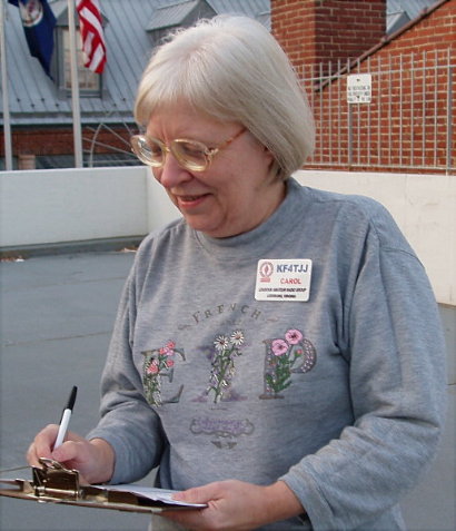 Carol Boehler - KF4TJJ of Leesburg runs through her check list. Photograph by Norm Styer - AI2C of Clarkes Gap, Virginia.